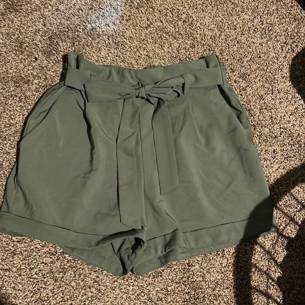 These at green shorts with a belt and stretches.